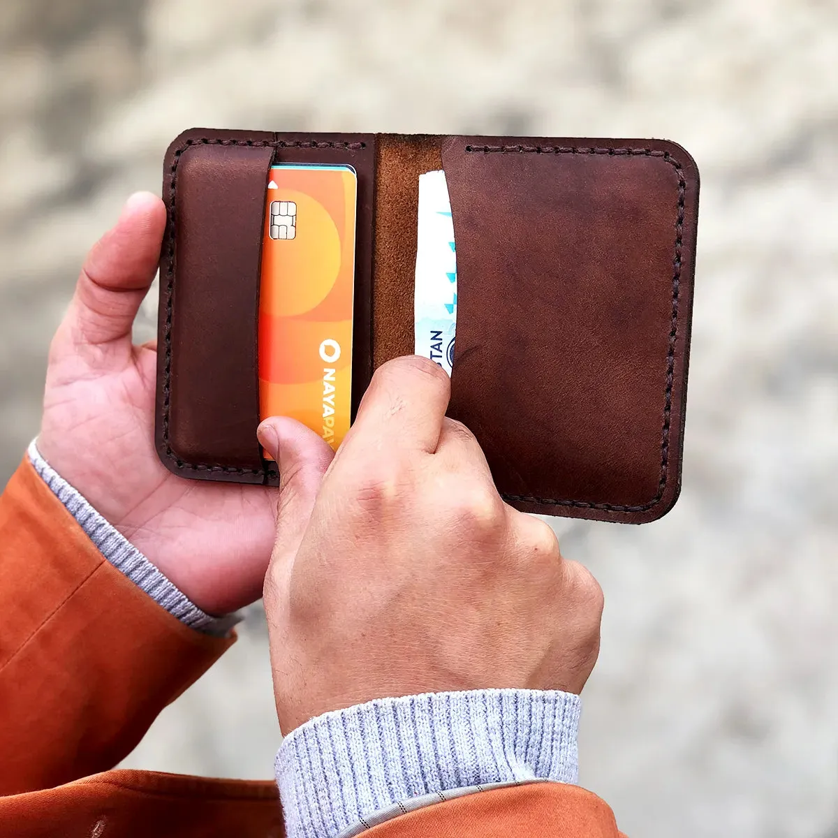 The Vertical Convenience: A Leather Bifold Wallet